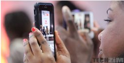 Woman watching live video on Facebook