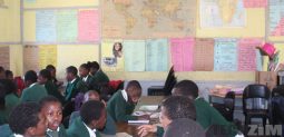 School children in classroom taking exam