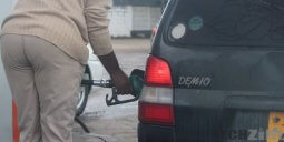 Man filling a car up with fuel